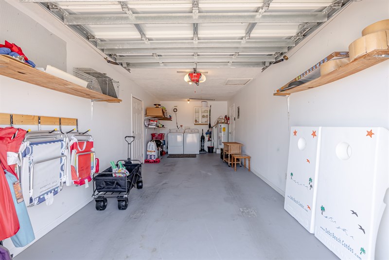 Garage - full size washer/dryer;  beach wagon, chairs and corn hole